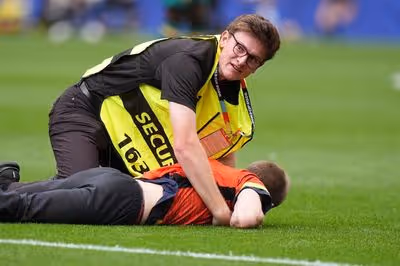 World Cup match halted as multiple protesters taken down and removed from pitch